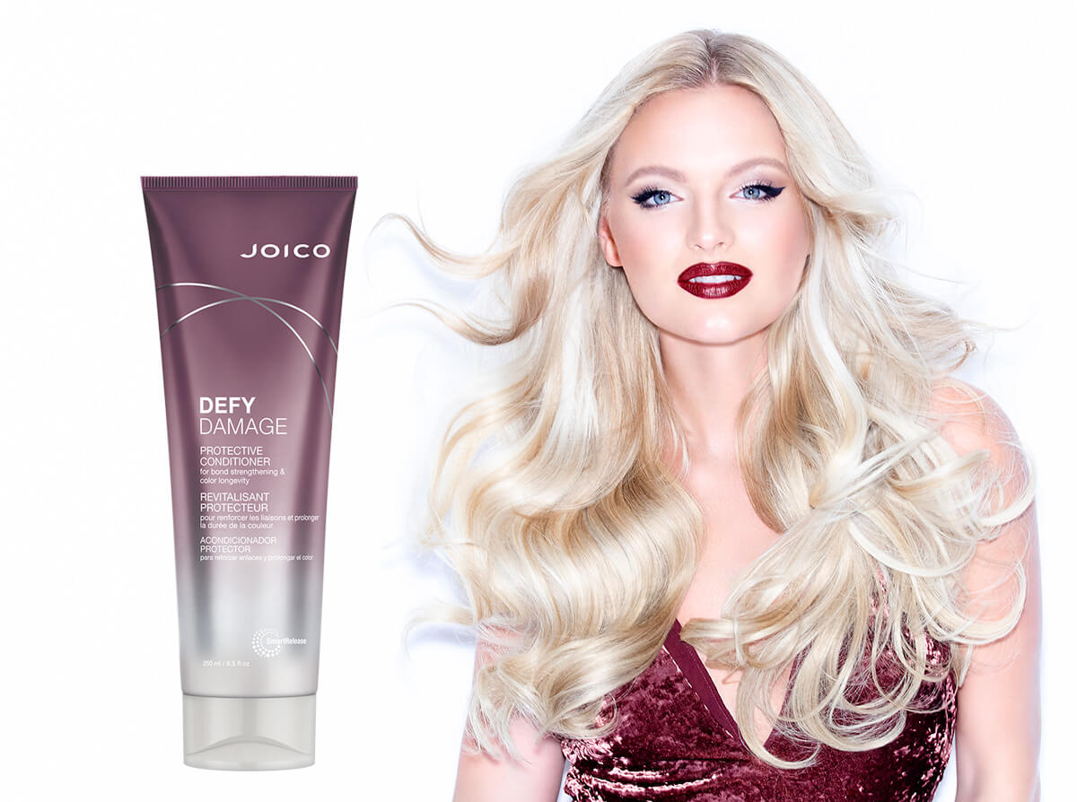 Defy Damage Conditioner bottle and Hair Model