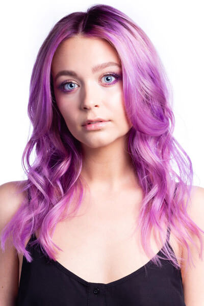 Larisa Love hair model showing vibrant purple hair color