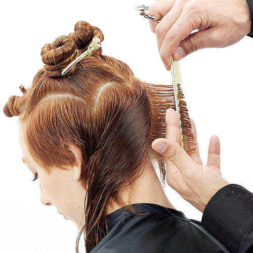 Hairstylist Richard Mannah cutting a bob