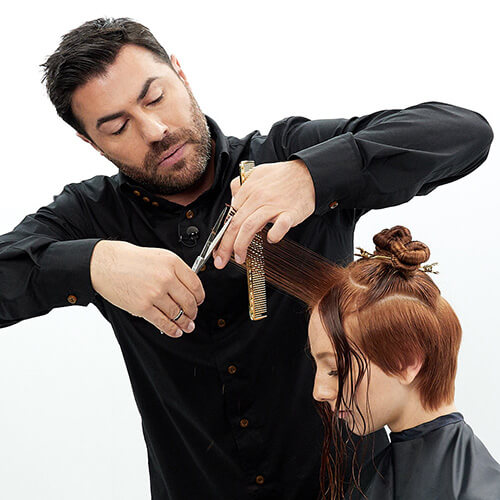 Hairstylist Richard Mannah cutting a bob