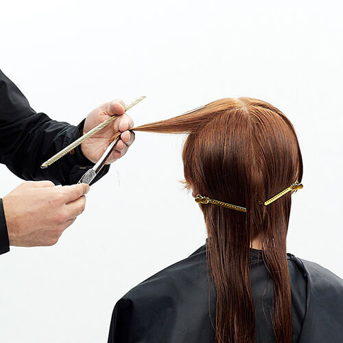 Hairstylist Richard Mannah cutting a bob