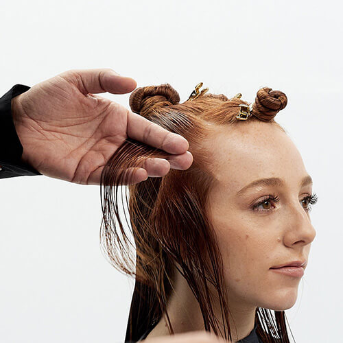 Hairstylist Richard Mannah cutting a bob