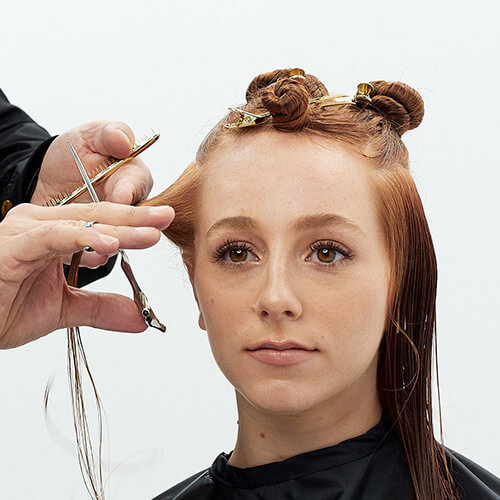Hairstylist Richard Mannah cutting a bob