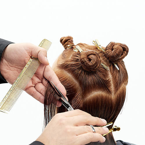 Hairstylist Richard Mannah cutting a bob