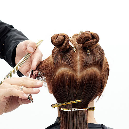 Hairstylist Richard Mannah cutting a bob