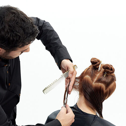 Hairstylist Richard Mannah cutting a bob