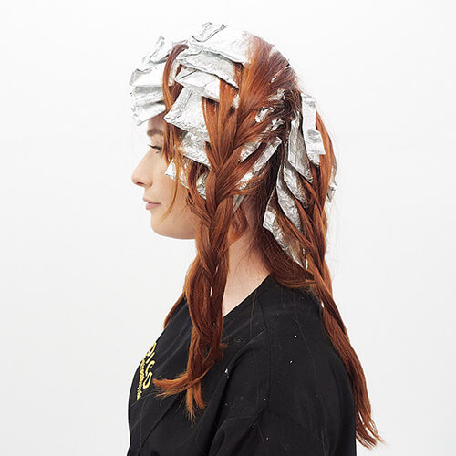 Clients hair in foils for coloring