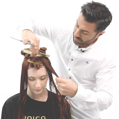 Hairstylist Richard Mannah coloring clients hair