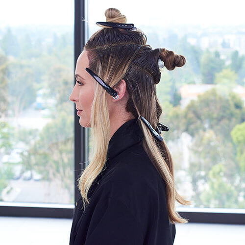 Hair being colored in foils