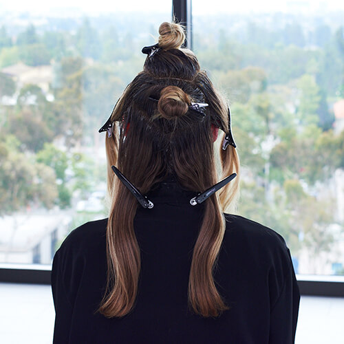 Hair being colored in foils