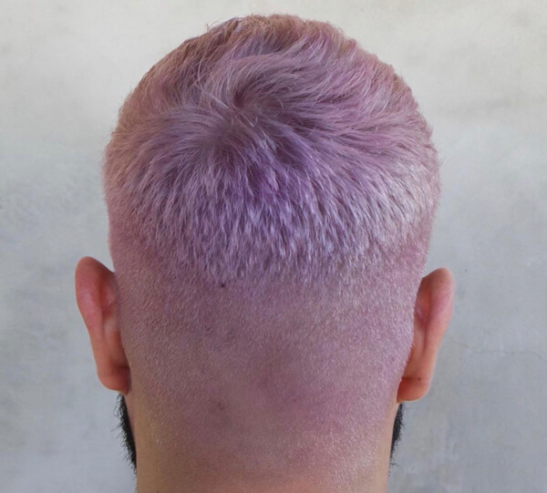 Man with short pink buzzed hair