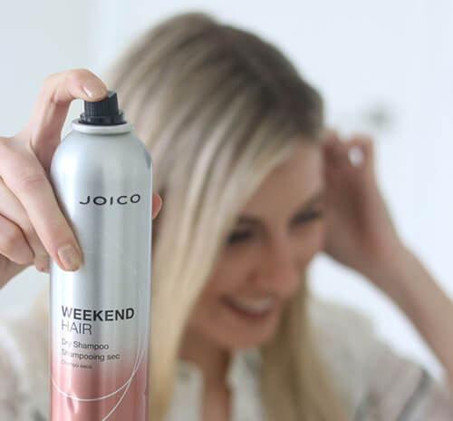 weekend-hair-olivia Women holidng bottle of Joico Dry Shampoo