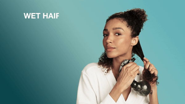 hair model spraying water on hair