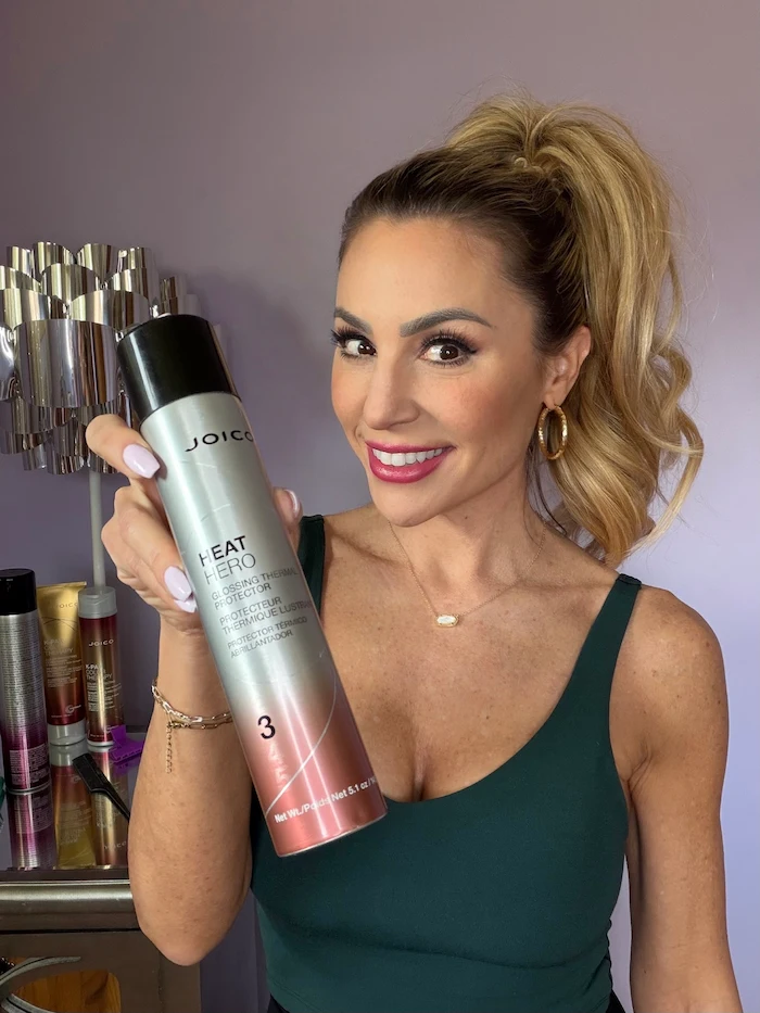 Vanessa Drozda with ponytail holding Hold Hero bottle